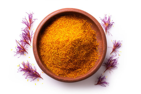 Dried saffron flowers in bowl isolated on white background.の素材