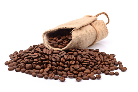 coffee beans in burlap bag isolated on a white background.の素材