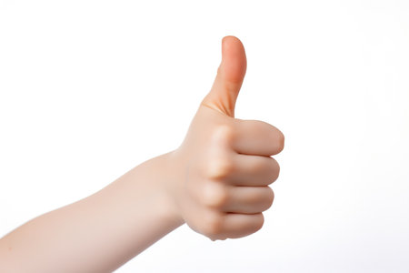Hand showing thumbs up sign isolated on white background. Close up.の素材