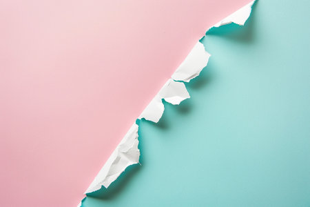Torn paper with space for your message on a pink background.の素材