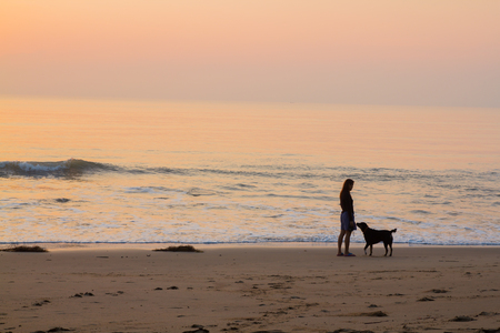 Sunrise at the sea and shadow of life.の写真素材