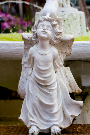 white statue of winged child.の写真素材