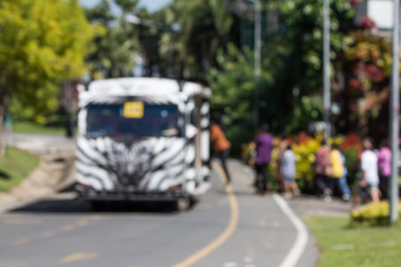 Blurred photo of people are taking the bus to visit the botanical gardens at various points.の写真素材