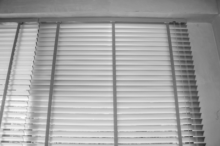 White louvers or Pull up blind use sun protection and beautiful.の写真素材