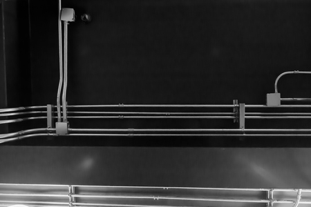 Pipe for wiring on the black ceiling.の写真素材