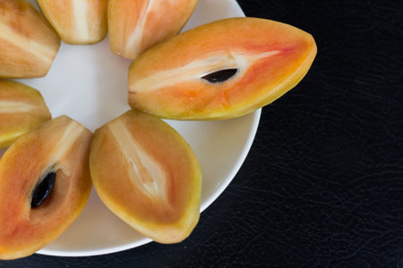 Lovelorn thai fruit on a white plate.