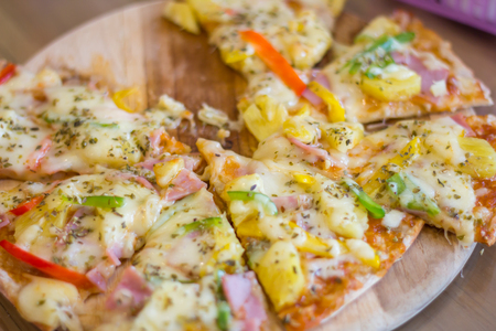Slices Of Pizza on wooden board.の写真素材