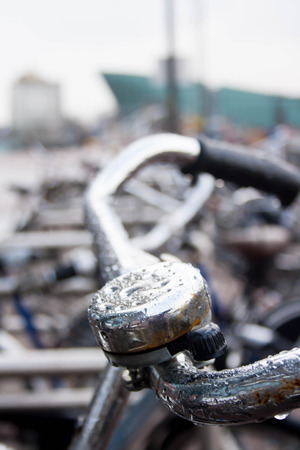 Wet bike bell in Amsterdam city center on a Sunday morningの写真素材