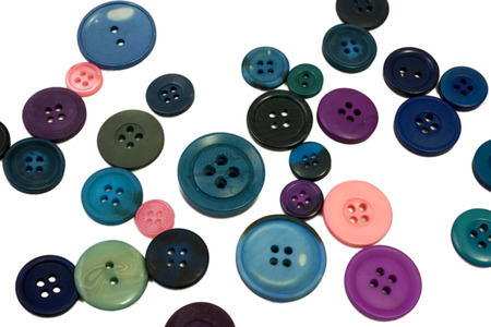 Several colors of buttons on an isolated white backgroundの写真素材