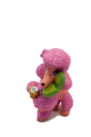 Plastic pink toy poodle on isolated whiteの写真素材