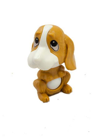 Plastic brown toy dog on isolated whiteの写真素材