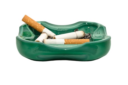 Closeup image of ashtray and cigarette butts, isolated on white backgroundの写真素材