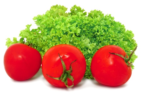 Closeup image of red tomatoes and green lettuce, isolated on white backgroundの写真素材