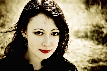 Closeup portrait of a beautiful smiling gothic girlの写真素材