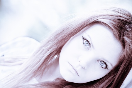 Closeup portrait of beautiful young girl in high keyの写真素材