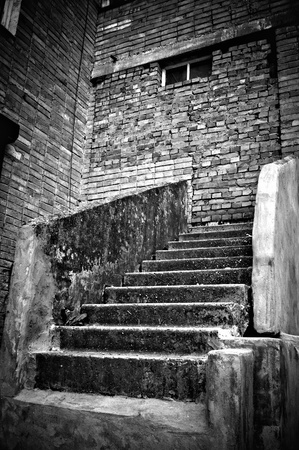 The strange staircase leading into brick wall. の写真素材