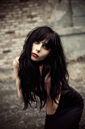 Beautiful Sad Goth Girl Standing On The Sea Shore Rear View