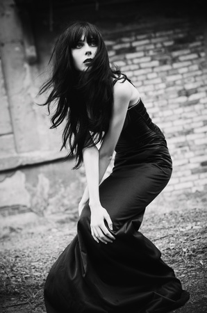 Portrait of a beautiful goth girl among the ruins  Black and whiteの写真素材
