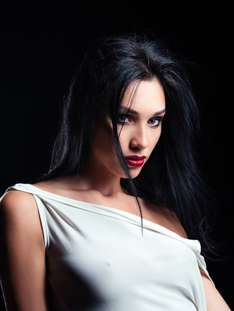 Studio fashion shot: dramatic portrait of a beautiful young womanの写真素材