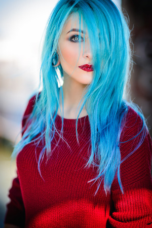 Portrait of a beautiful young woman with blue hairの写真素材
