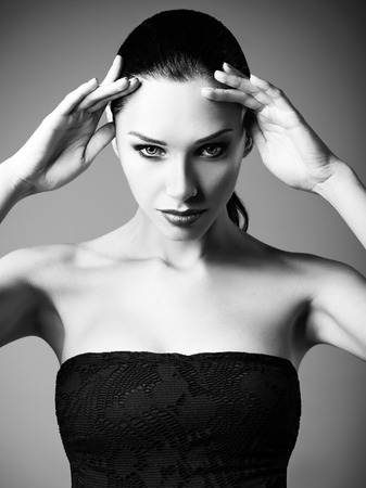 Studio fashion shot: portrait of a beautiful young woman. Black and whiteの写真素材