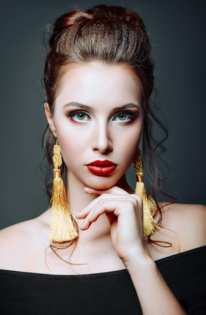 Studio close-up portrait of a beautiful young girlの写真素材
