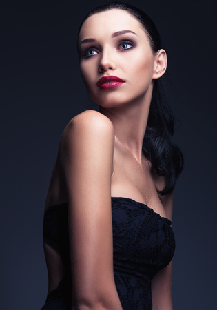 Studio fashion shot: portrait of a lovely young womanの写真素材