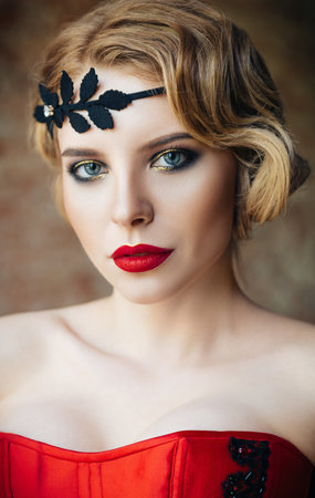 Close-up portrait of the beautiful young woman with diadem on head. Retro (vintage) styleの写真素材
