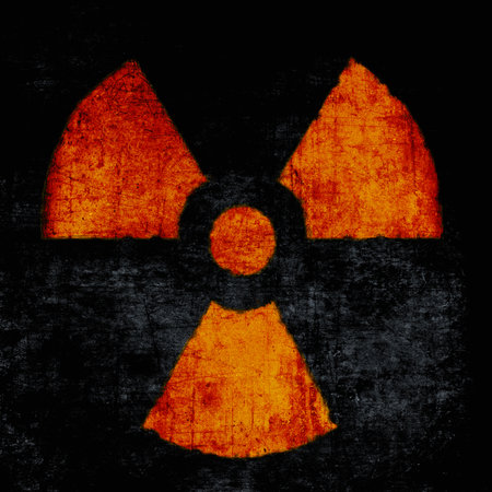 Radiation sign, red on black. Nuclear hazard emblem, grunge textured. Radioactive threat symbolの写真素材