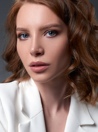 Studio shot of lovely young woman. Close-up portrait of the beautiful girlの写真素材