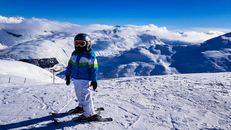 Winter holiday in the Alps mountains under blue sky.