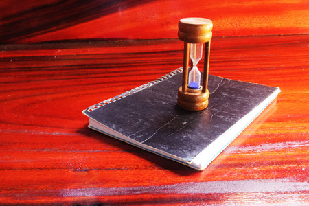 Hourglass on the notebook 