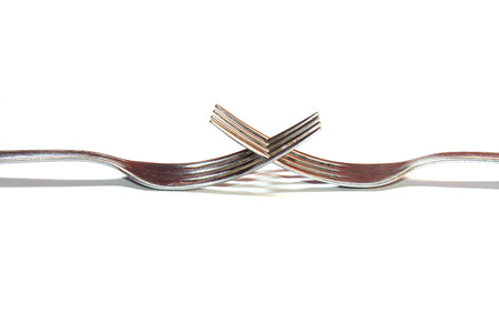 Close-up image of modern cutlery forks on the white background の写真素材