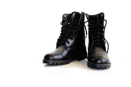 Black leather high top boots with untied lacesの写真素材