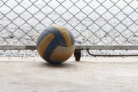 old Volleyball on concrete の写真素材