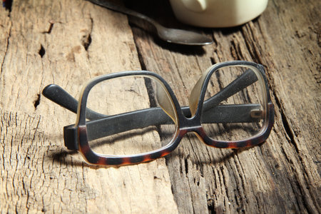 glasses and coffee cups on wood floors.の写真素材