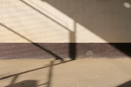 Sun lights and shadow on the old wallsの写真素材