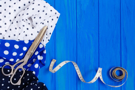 Dotted fabrics collection, measuring tape and tailoring scissors