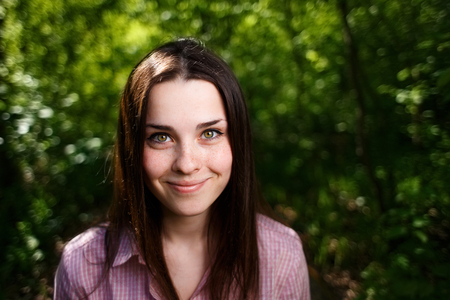 Portrait of cheerful smiling cute young woman  with long hair anの写真素材