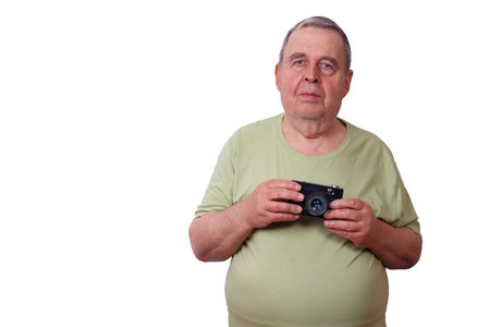 Portrait of senior elderly satisfied man with retro film camera,