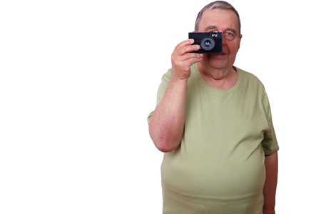 Old man satisfied man taking picture with retro film camera, isoの写真素材