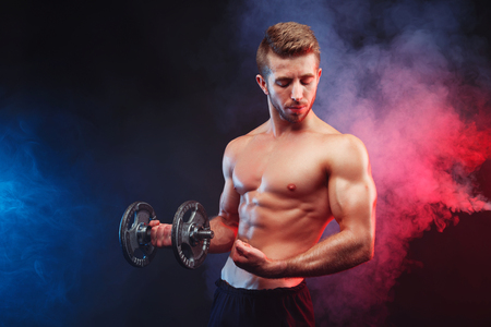 Young ripped man bodybuilder with perfect abs, shoulders,biceps,の写真素材