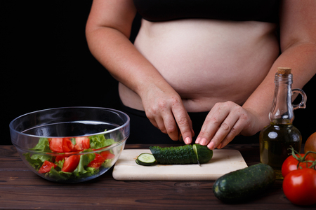 Dieting, healthy food, weight losing, well-being. Overweight fatの写真素材