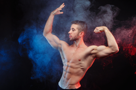 Young fit man bodybuilder with perfect big muscles. Muscled maleの写真素材