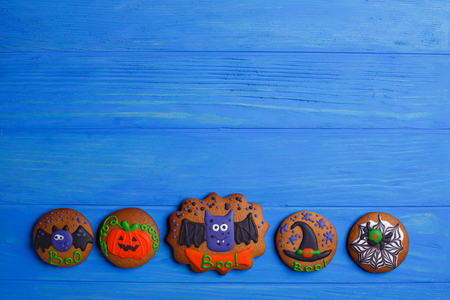 Halloween ginger cookies on wooden rustic kitchen table, flat laの写真素材