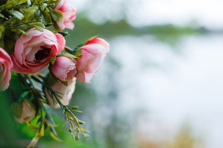 Colorful fake silk flowers, beautiful decoration close up. Copy spaceの写真素材
