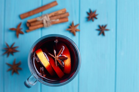 Mulled wine, spices and food decorations on bright background, tの写真素材