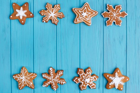 Christmas gingerbread  snowflake cookies set on bright blue backの写真素材