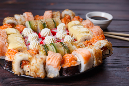 Tasty appetizing multicolored sushi rolls set, served with soy sの写真素材