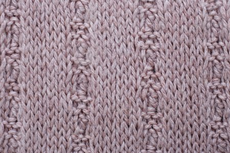 Knitted texture of beige woolen fabric with pattern. Copyspace,の写真素材